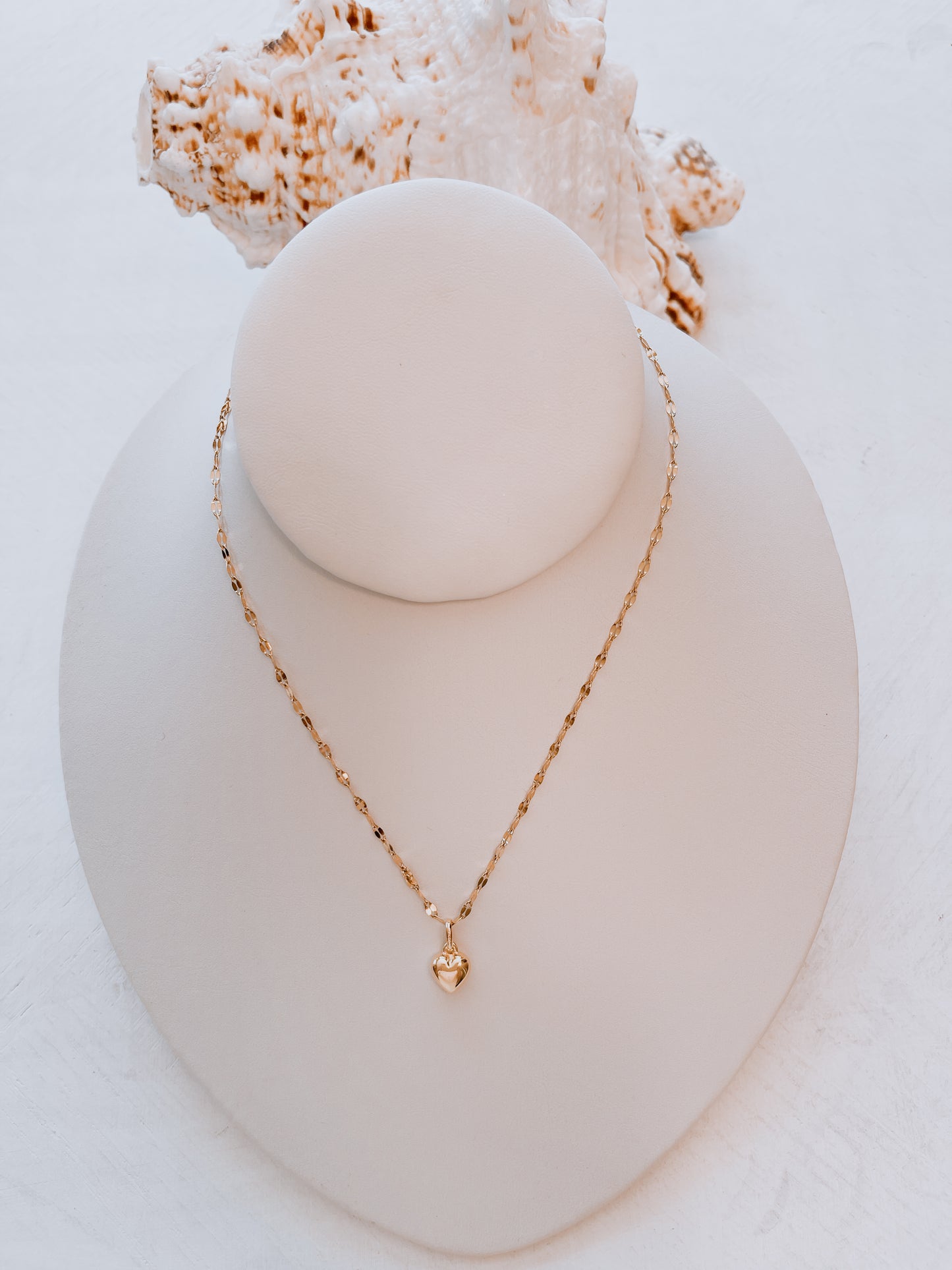 OroAmerigo Sunrise Collection with heart pendant.