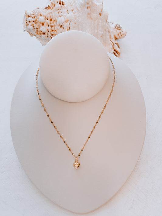 OroAmerigo Sunrise Collection with heart pendant.